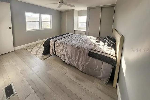 a bedroom with a bed and a shower