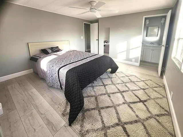 a white toilet sitting next to a bathroom sink