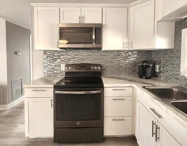a kitchen with a stove and a microwave
