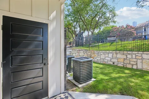 a backyard of a house with barbeque oven