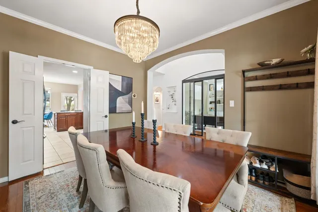 a large kitchen with stainless steel appliances granite countertop a stove a sink dishwasher and cabinets with wooden floor