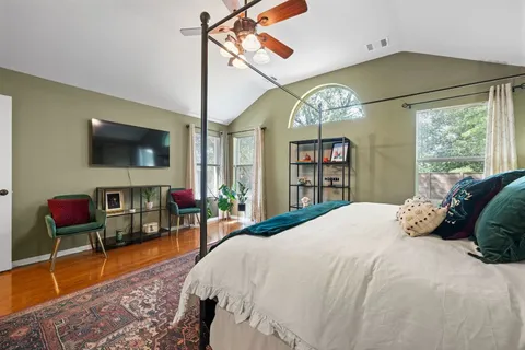 a living room with furniture cabinets and a table