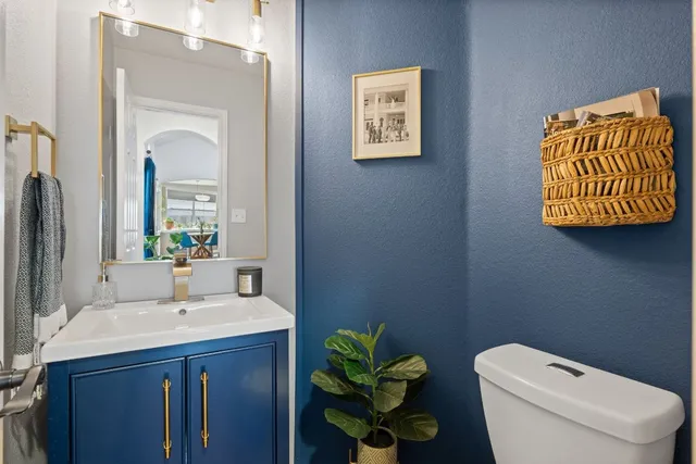 a bathroom with a sink a vanity and a mirror