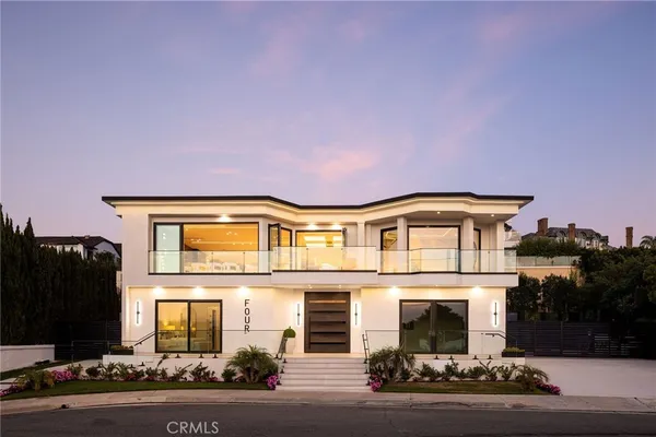 a front view of a house with yard