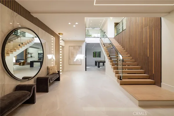a living room with furniture tv and a large window
