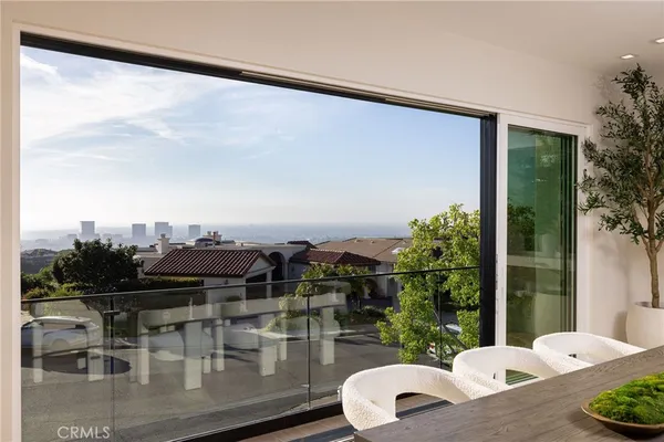 a view of balcony with furniture