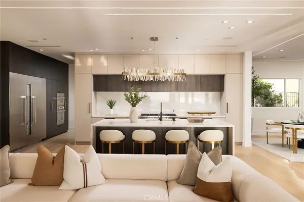 a kitchen with a sink and a refrigerator