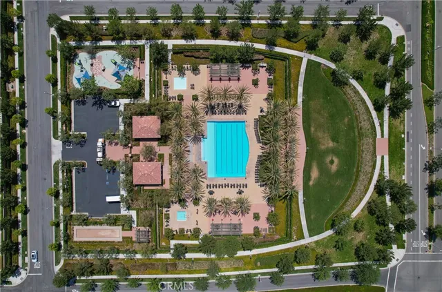 an aerial view of a residential houses with outdoor space