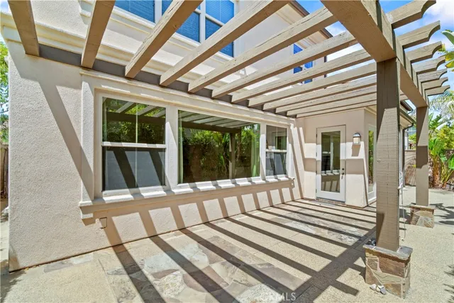 a view of a house with wooden floor and wooden fence