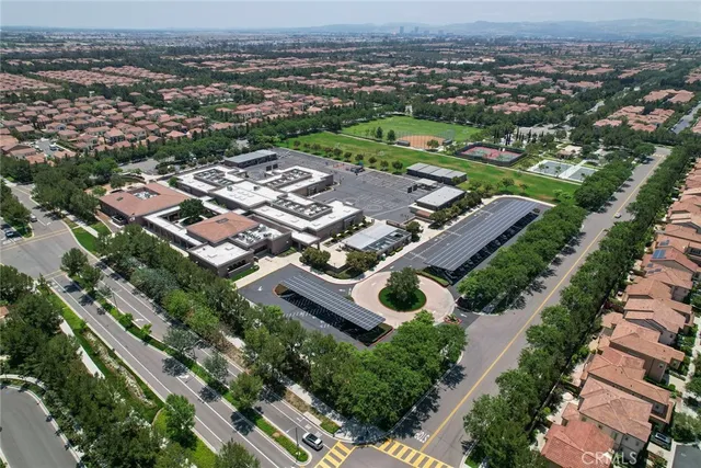 an aerial view of residential houses with city view