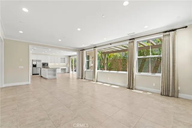 a view of a livingroom with furniture and an entryway