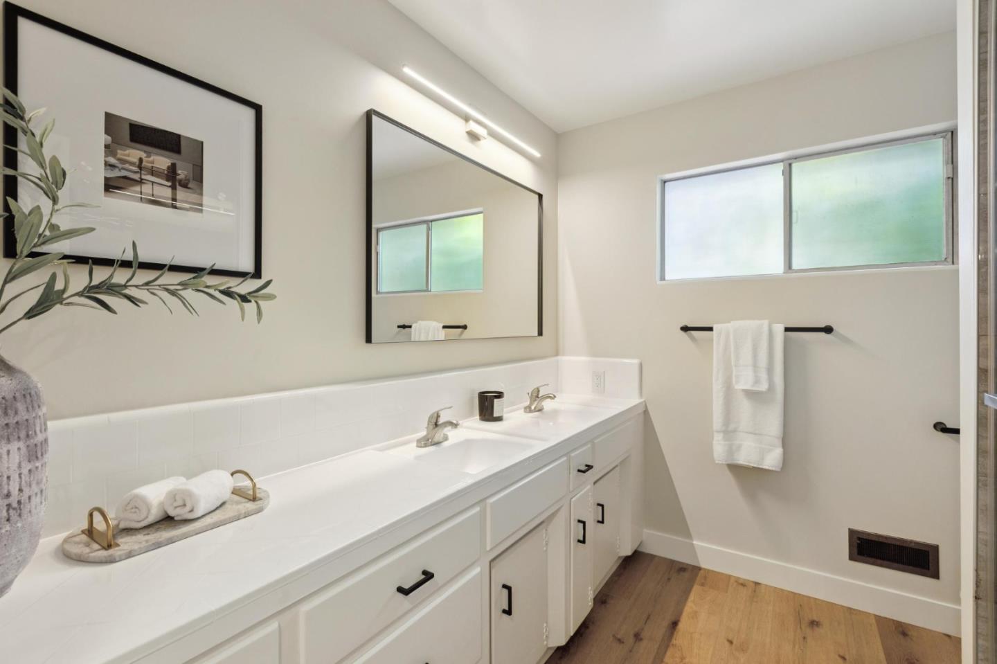 755 Santa Rita Avenue Los Altos, CA 94022 - Photo 37 of 50 a bathroom with a double vanity sink mirror and bathtub