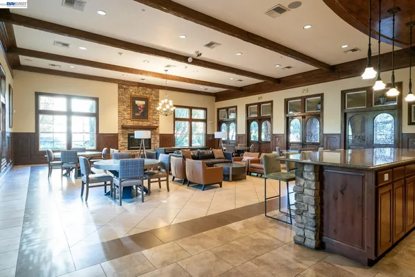 a living room with lots of furniture and a chandelier