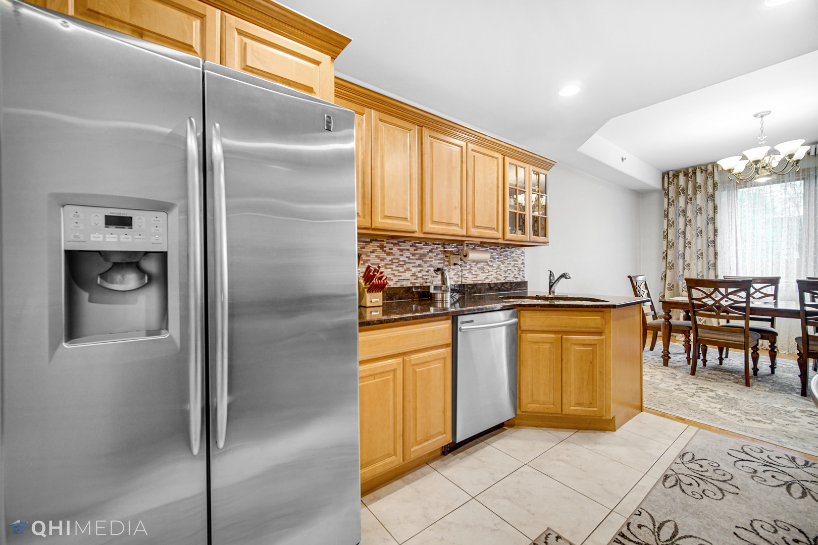 8832 South Roberts Road Hickory Hills, IL 60457 - Photo 4 of 16 a kitchen with stainless steel appliances granite countertop a refrigerator a stove and a sink with granite countertops