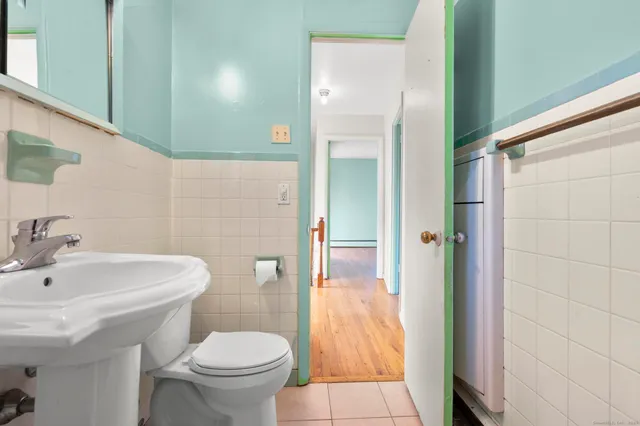 a bathroom with a sink and toilet
