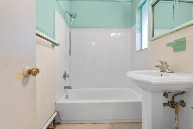 a bathroom with a white bath tub