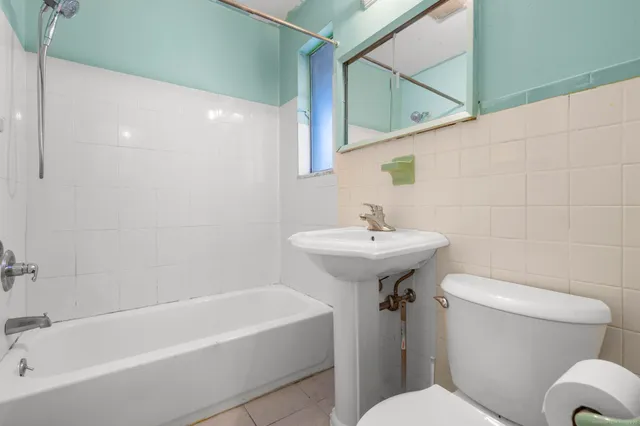 a bathroom with a sink toilet and bathtub