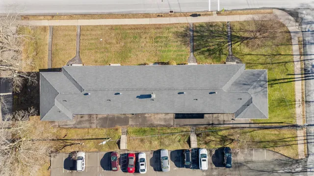 an aerial view of residential houses with outdoor space