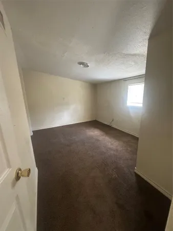 a white toilet sitting next to a bath tub
