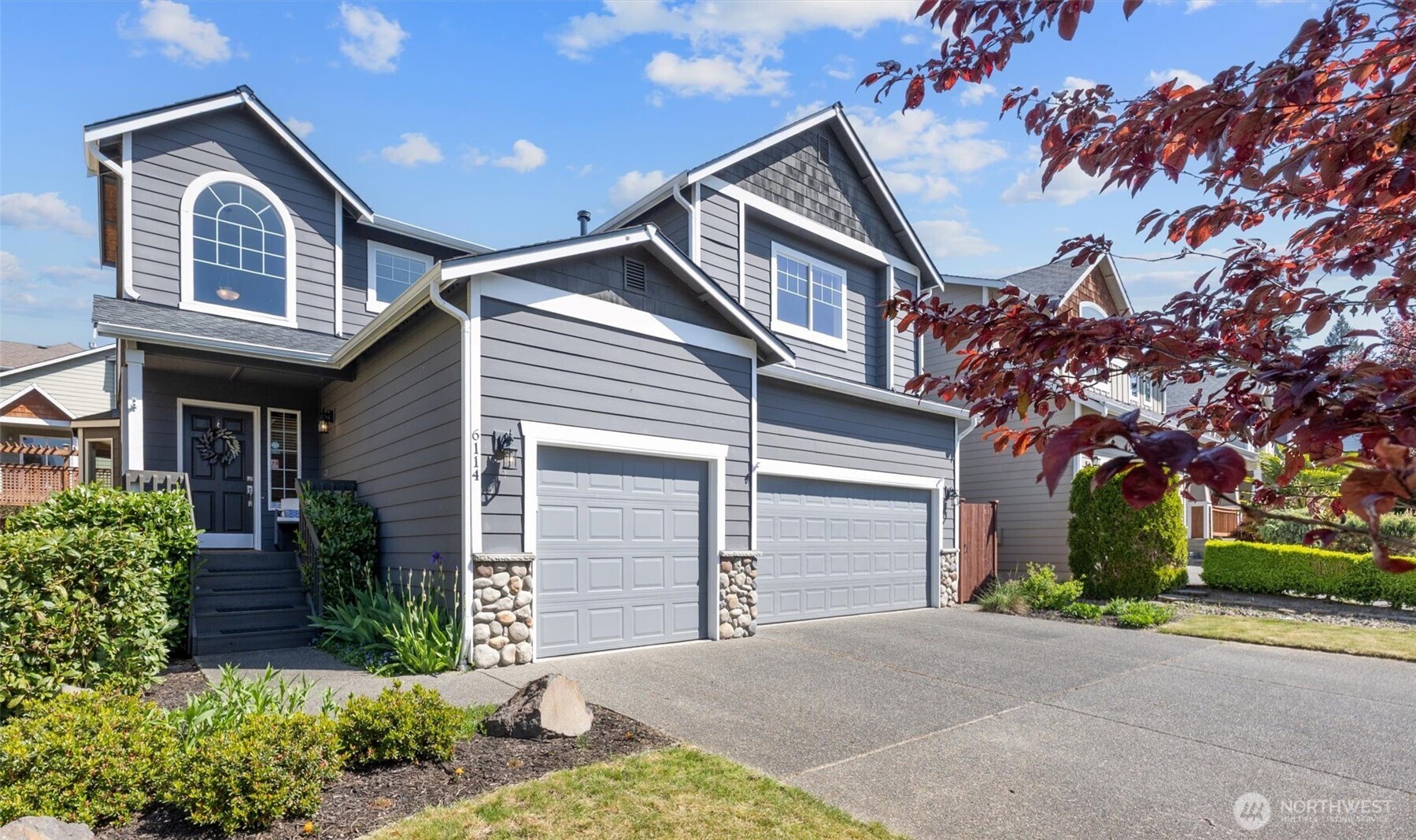 6114 Southeast 2nd Lane Renton, WA 98059 - Photo 3 of 39 a front view of a house with garden