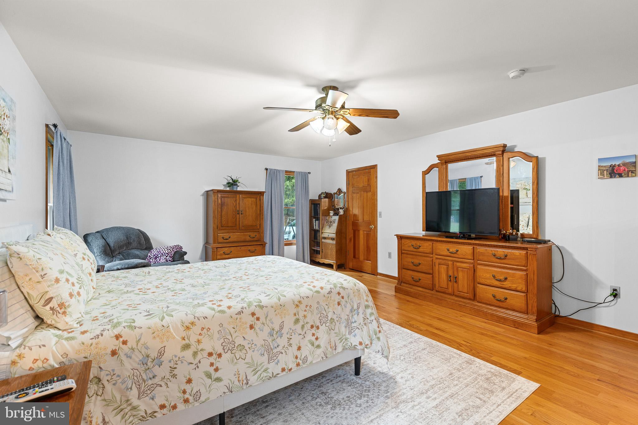 21246 Clarks Mountain Road Rapidan, VA 22733 - Photo 22 of 38 a bedroom with a bed and a dresser