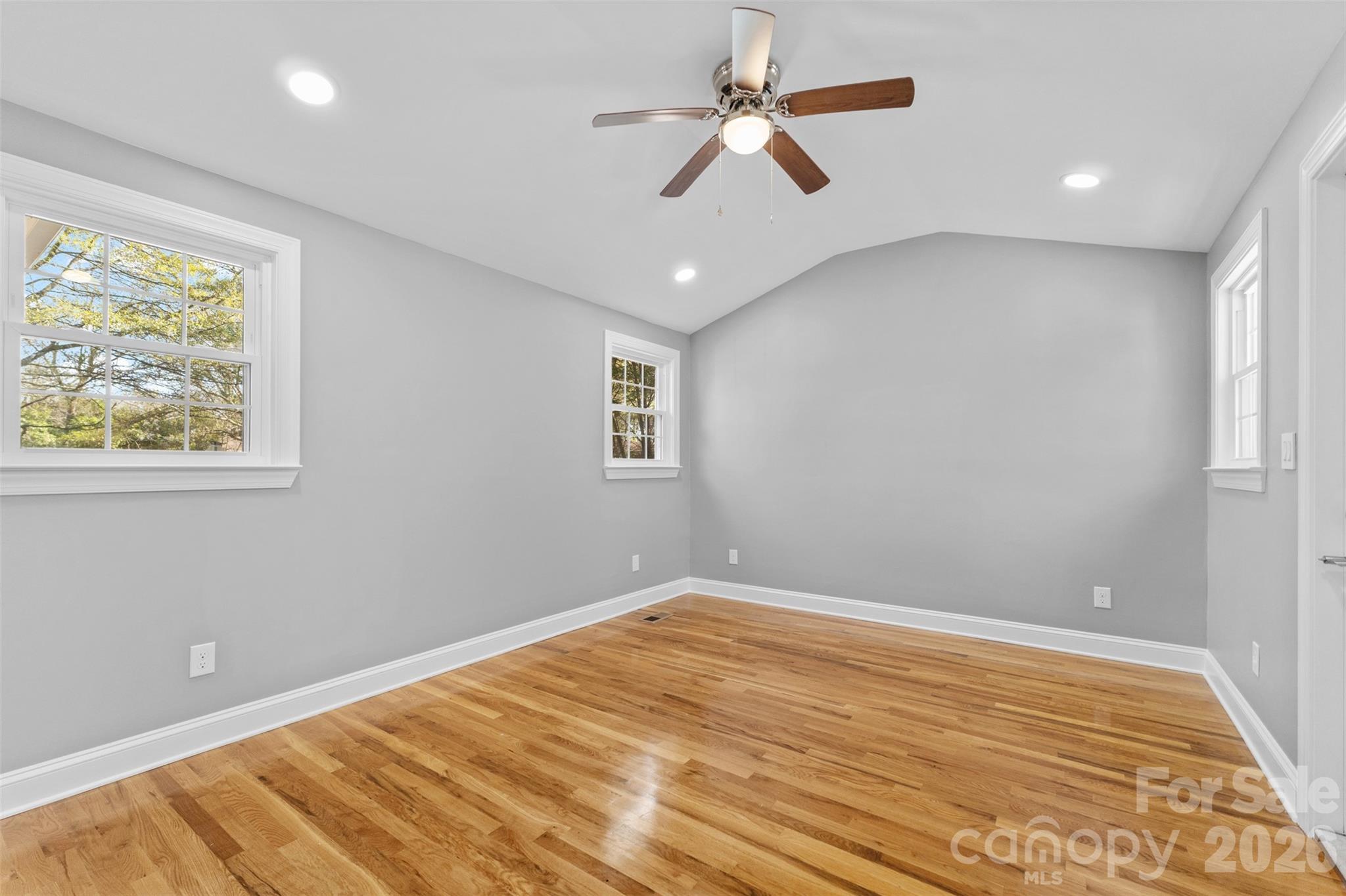 206 Hunter Street York, SC 29745 - Photo 13 of 20 a view of empty room with wooden floor and fan