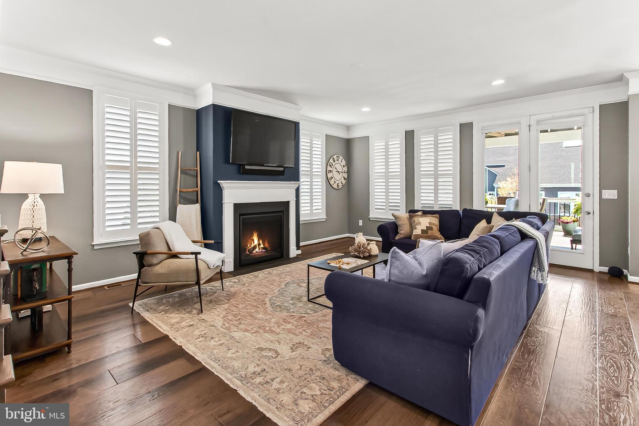1103 Themis Street Southeast Leesburg, VA 20175 - Photo 19 of 108 a living room with furniture fireplace and a flat screen tv