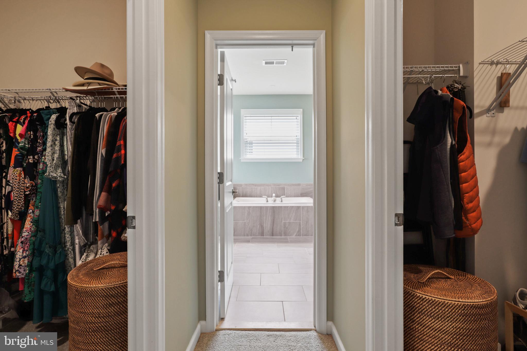 1103 Themis Street Southeast Leesburg, VA 20175 - Photo 60 of 108 a view of walk in closet with clothes and shoes