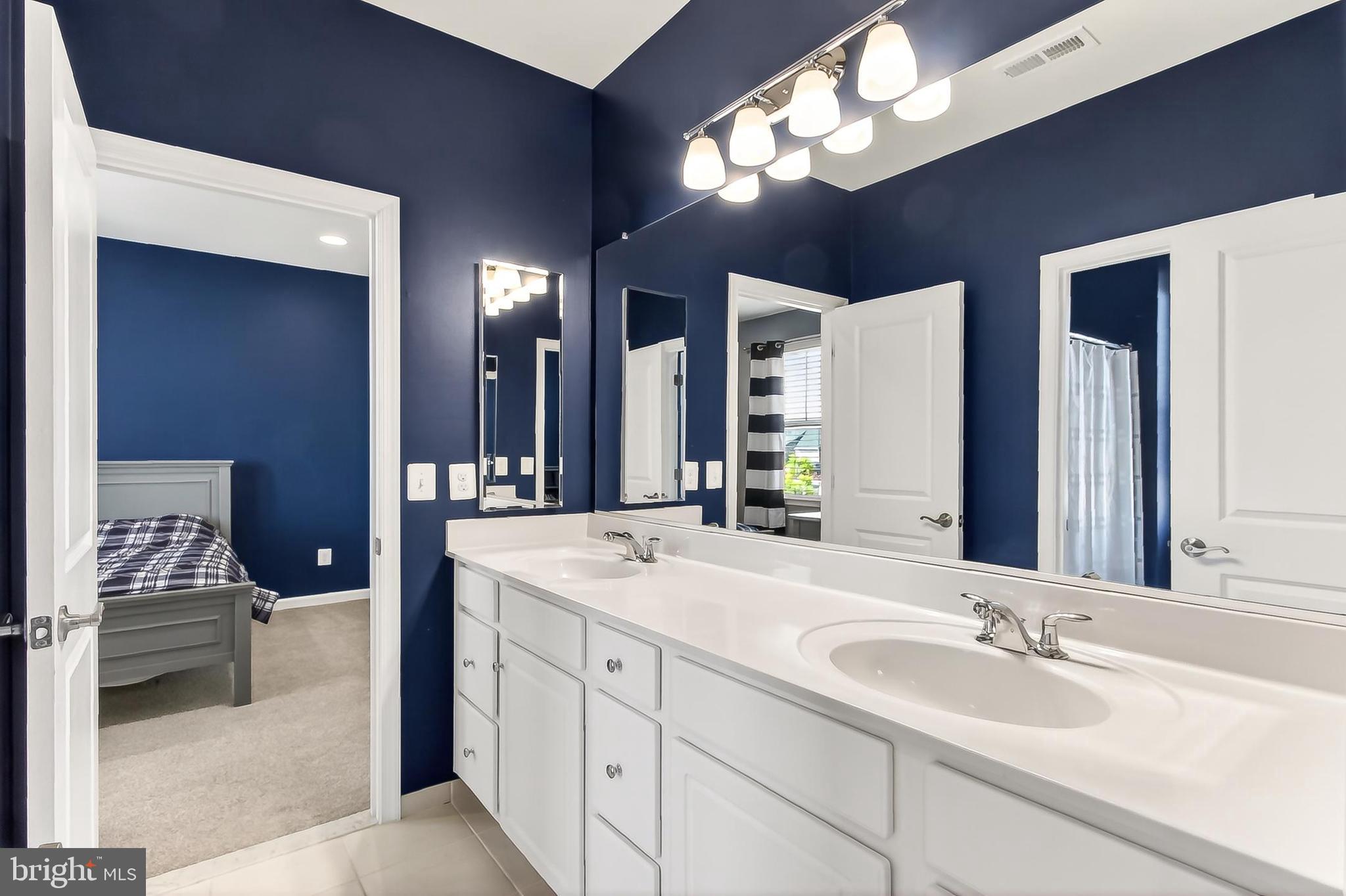 1103 Themis Street Southeast Leesburg, VA 20175 - Photo 65 of 108 Sleek dual sink vanity in buddy bathroom