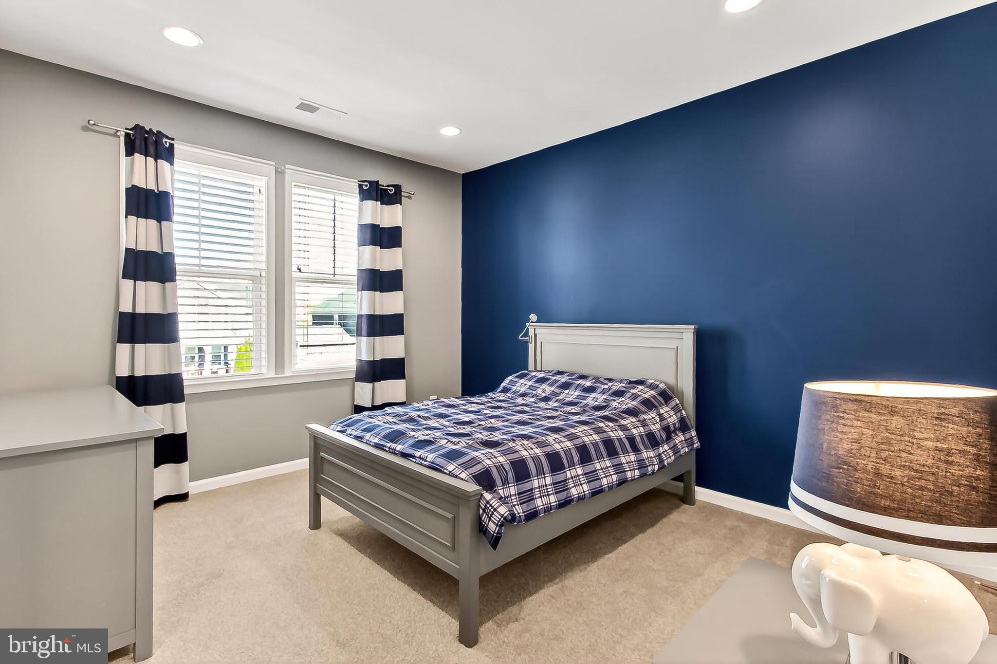 1103 Themis Street Southeast Leesburg, VA 20175 - Photo 67 of 108 a bedroom with a bed and a window