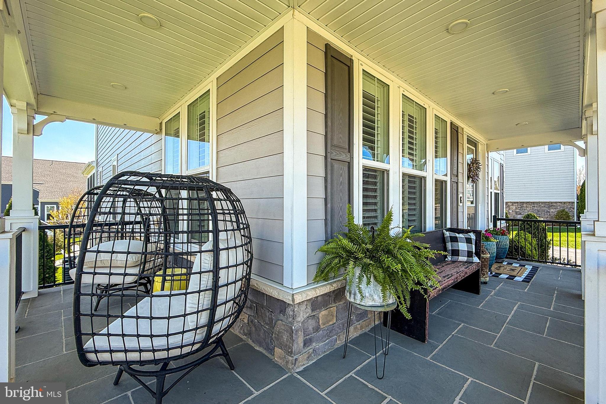 1103 Themis Street Southeast Leesburg, VA 20175 - Photo 7 of 108 Enjoy relaxing on the cozy wraparound porch