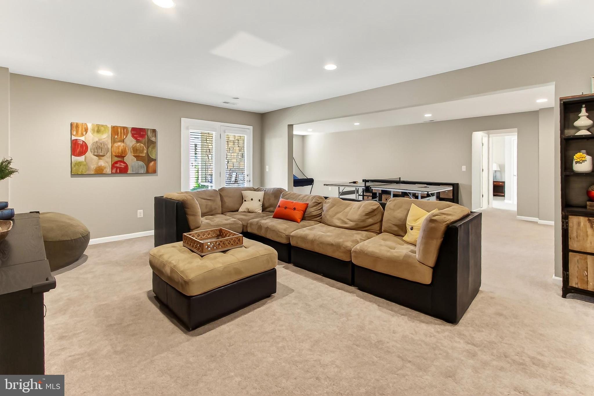 1103 Themis Street Southeast Leesburg, VA 20175 - Photo 74 of 108 a living room with furniture and a large window