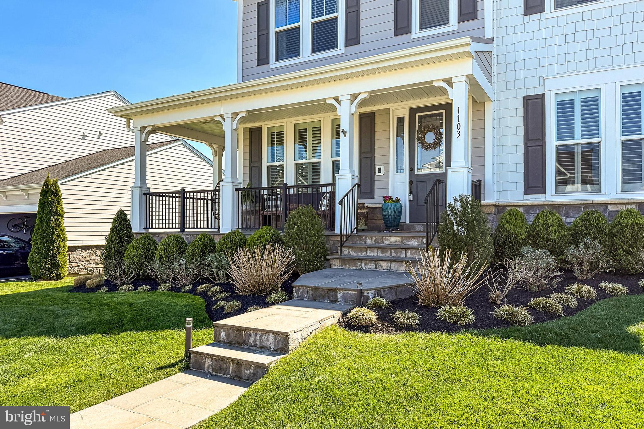 1103 Themis Street Southeast Leesburg, VA 20175 - Photo 82 of 108 a front view of a house with a yard table and chairs