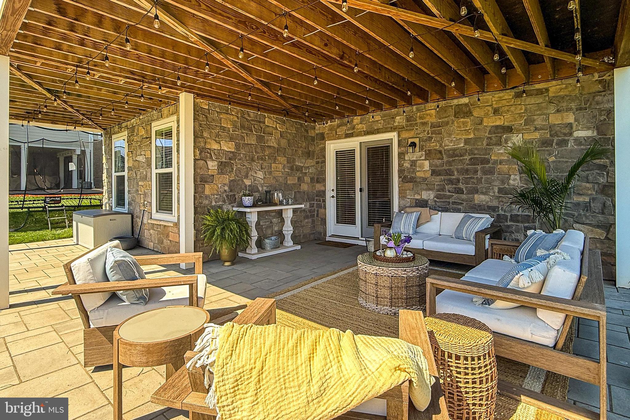 1103 Themis Street Southeast Leesburg, VA 20175 - Photo 89 of 108 a view of a patio with couches chairs and a wooden floor