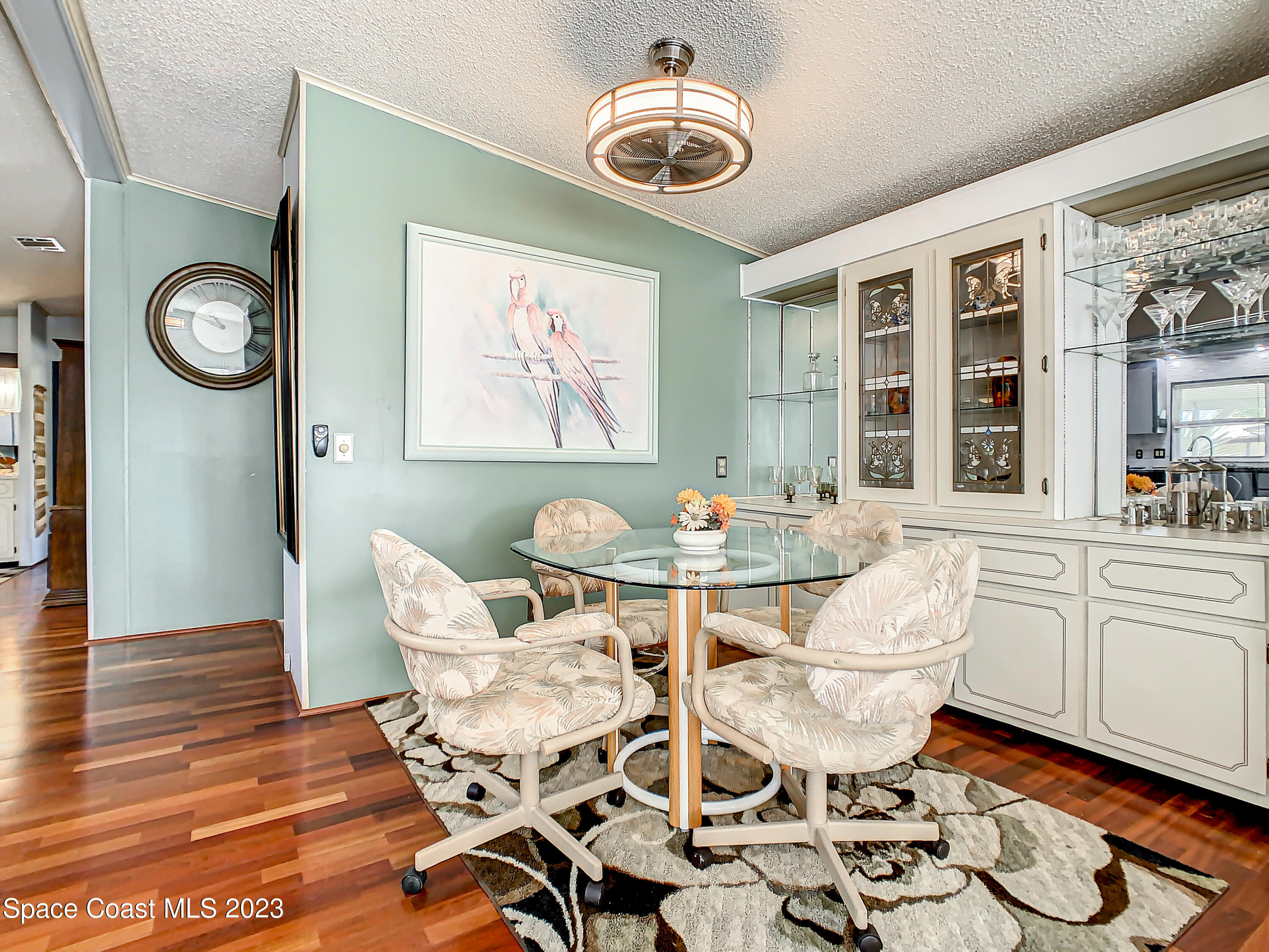 832 Periwinkle Circle Sebastian, FL 32976 - Photo 14 of 52 a view of a dining room with furniture a chandelier and wooden floor