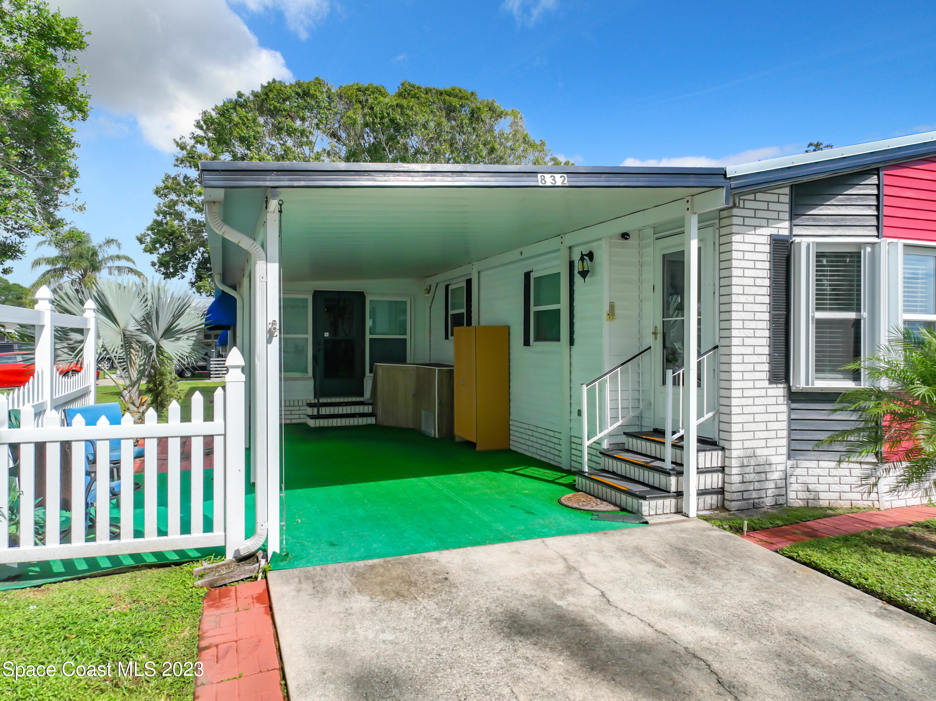 832 Periwinkle Circle Sebastian, FL 32976 - Photo 2 of 52 a view of a house with a yard and plants