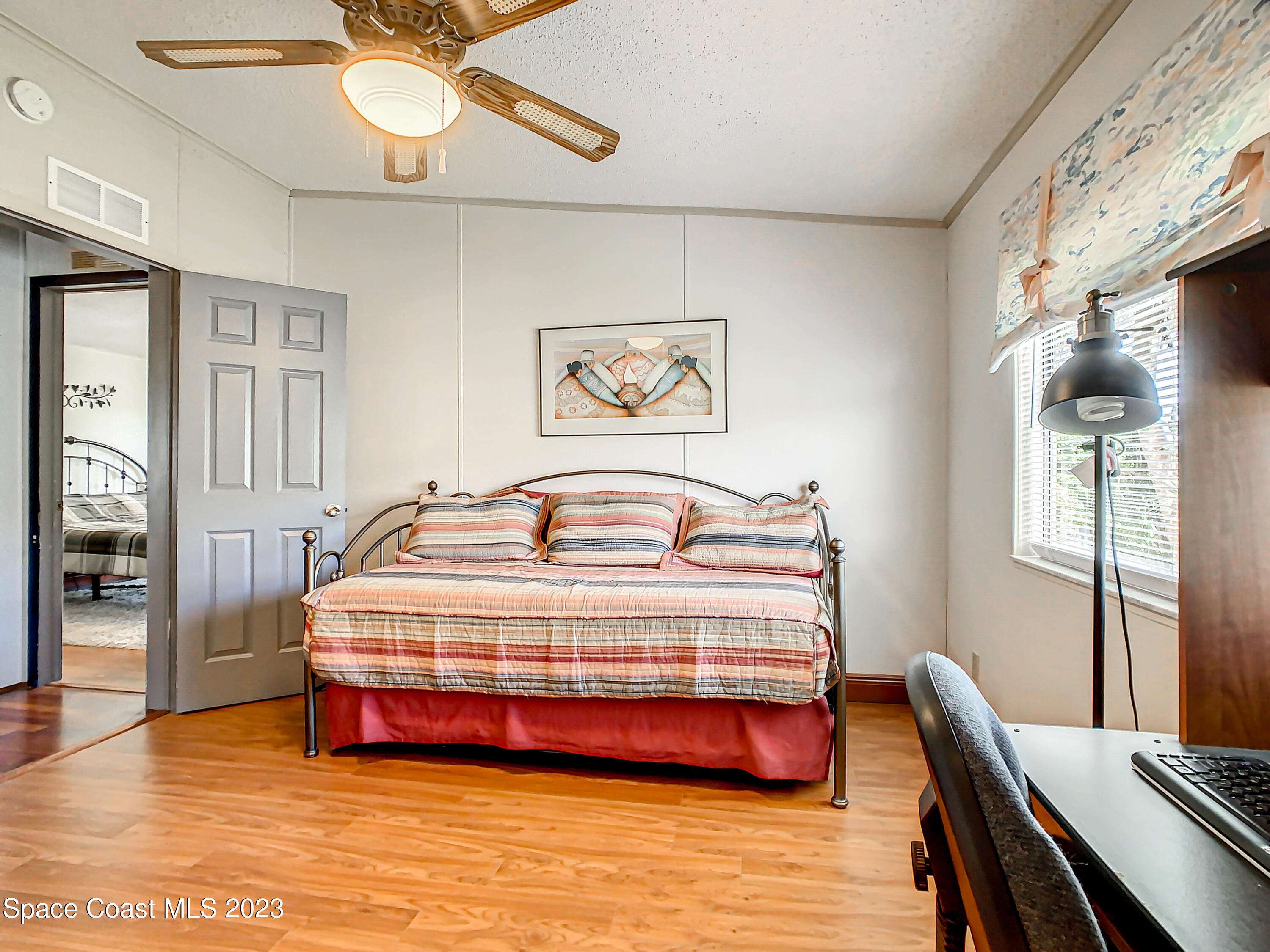 832 Periwinkle Circle Sebastian, FL 32976 - Photo 22 of 52 a bedroom with bed and window