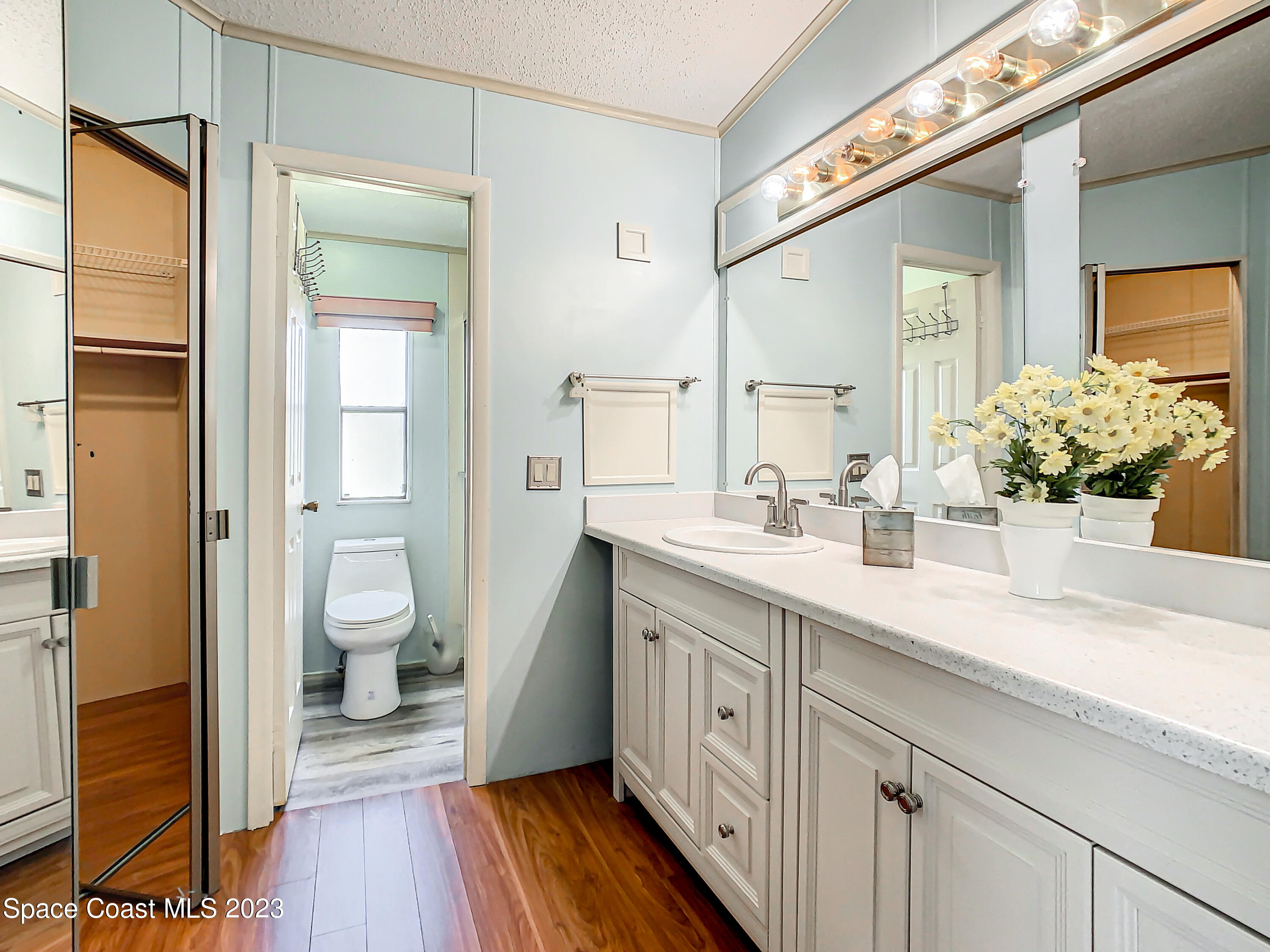 832 Periwinkle Circle Sebastian, FL 32976 - Photo 30 of 52 a spacious bathroom with a granite countertop sink toilet and shower