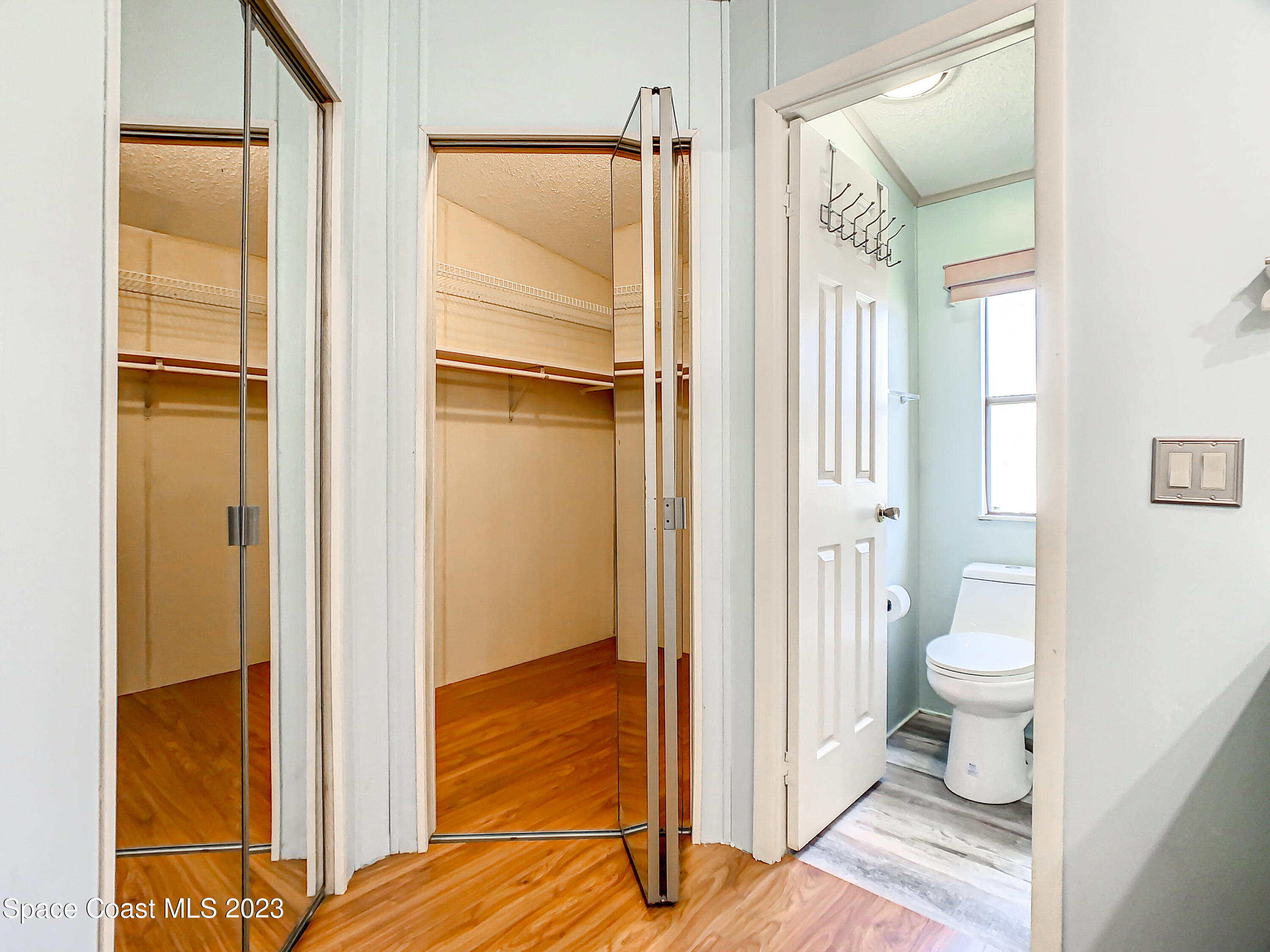 832 Periwinkle Circle Sebastian, FL 32976 - Photo 31 of 52 a bathroom with a granite countertop sink and a mirror