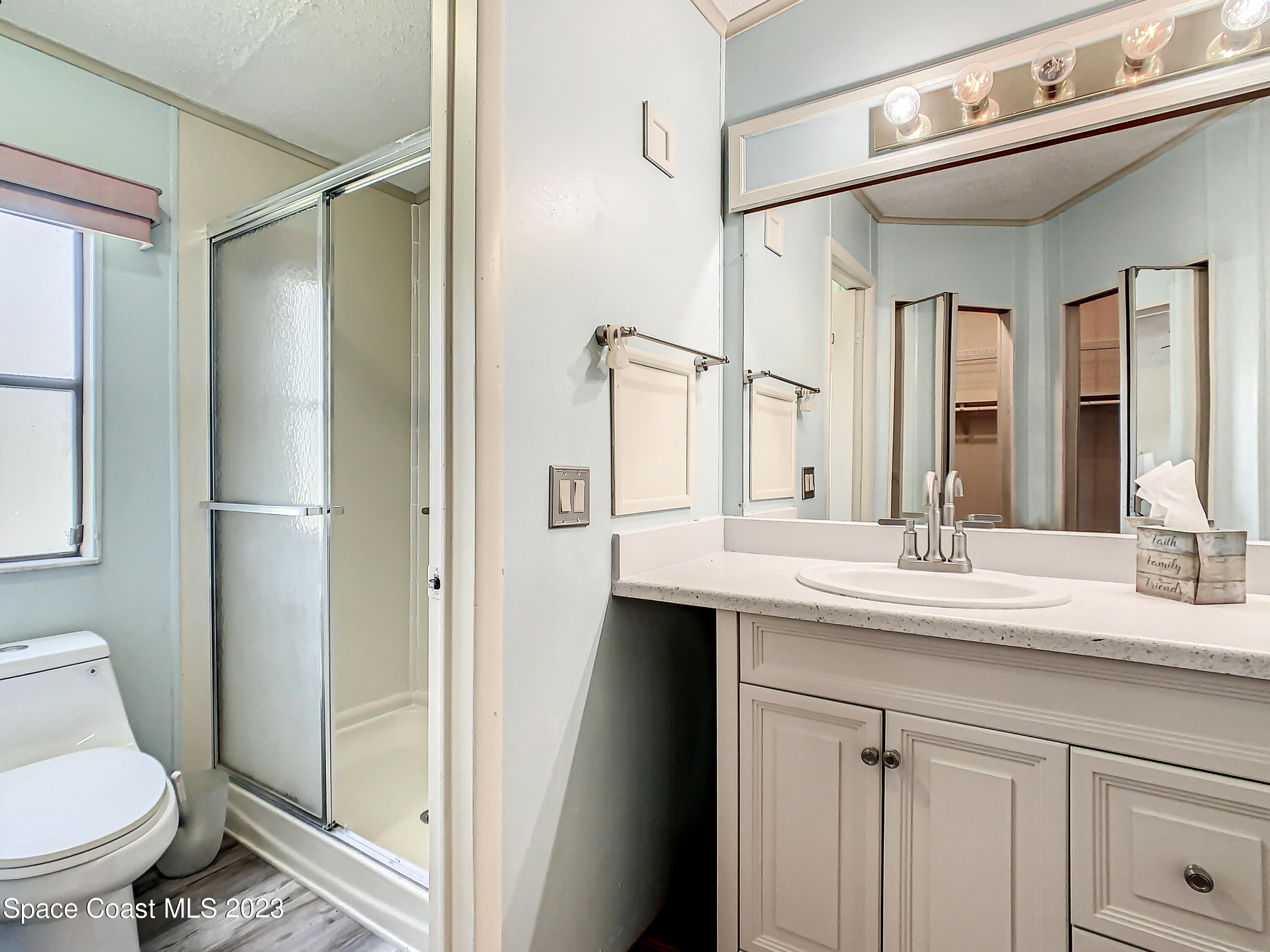 832 Periwinkle Circle Sebastian, FL 32976 - Photo 32 of 52 a bathroom with a sink toilet and shower