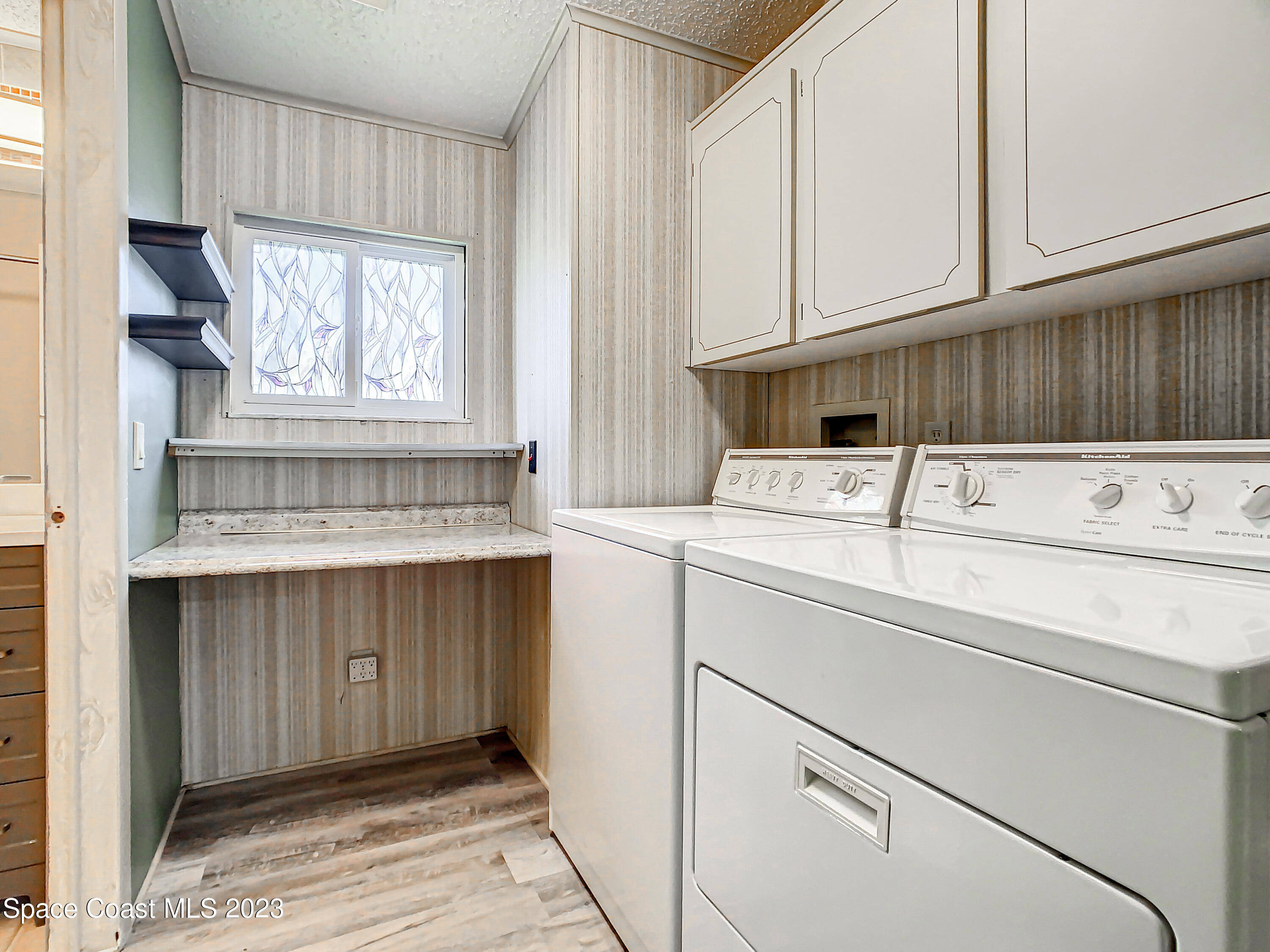 832 Periwinkle Circle Sebastian, FL 32976 - Photo 34 of 52 a utility room with dryer and washer