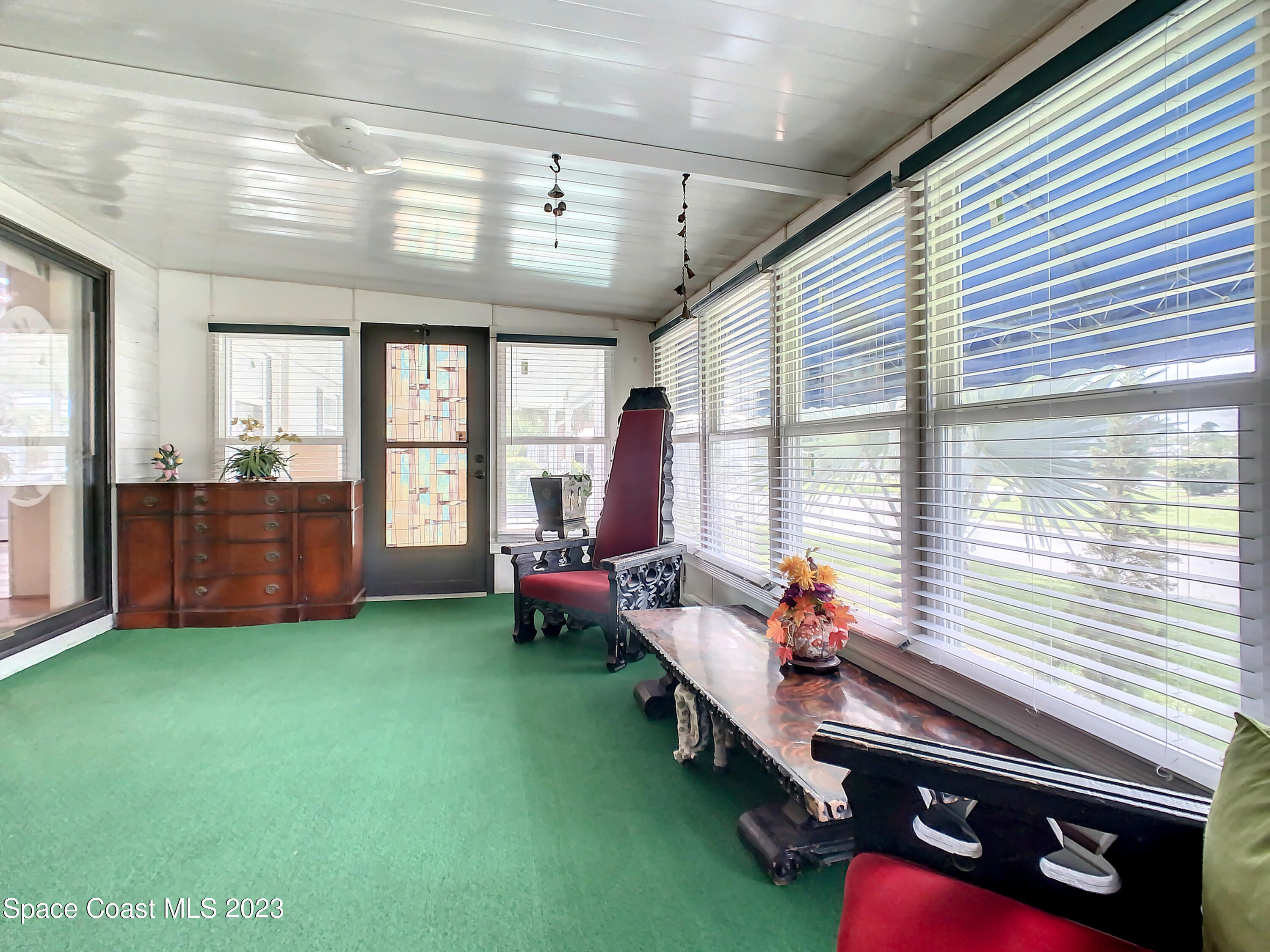 832 Periwinkle Circle Sebastian, FL 32976 - Photo 37 of 52 a living room with furniture and windows