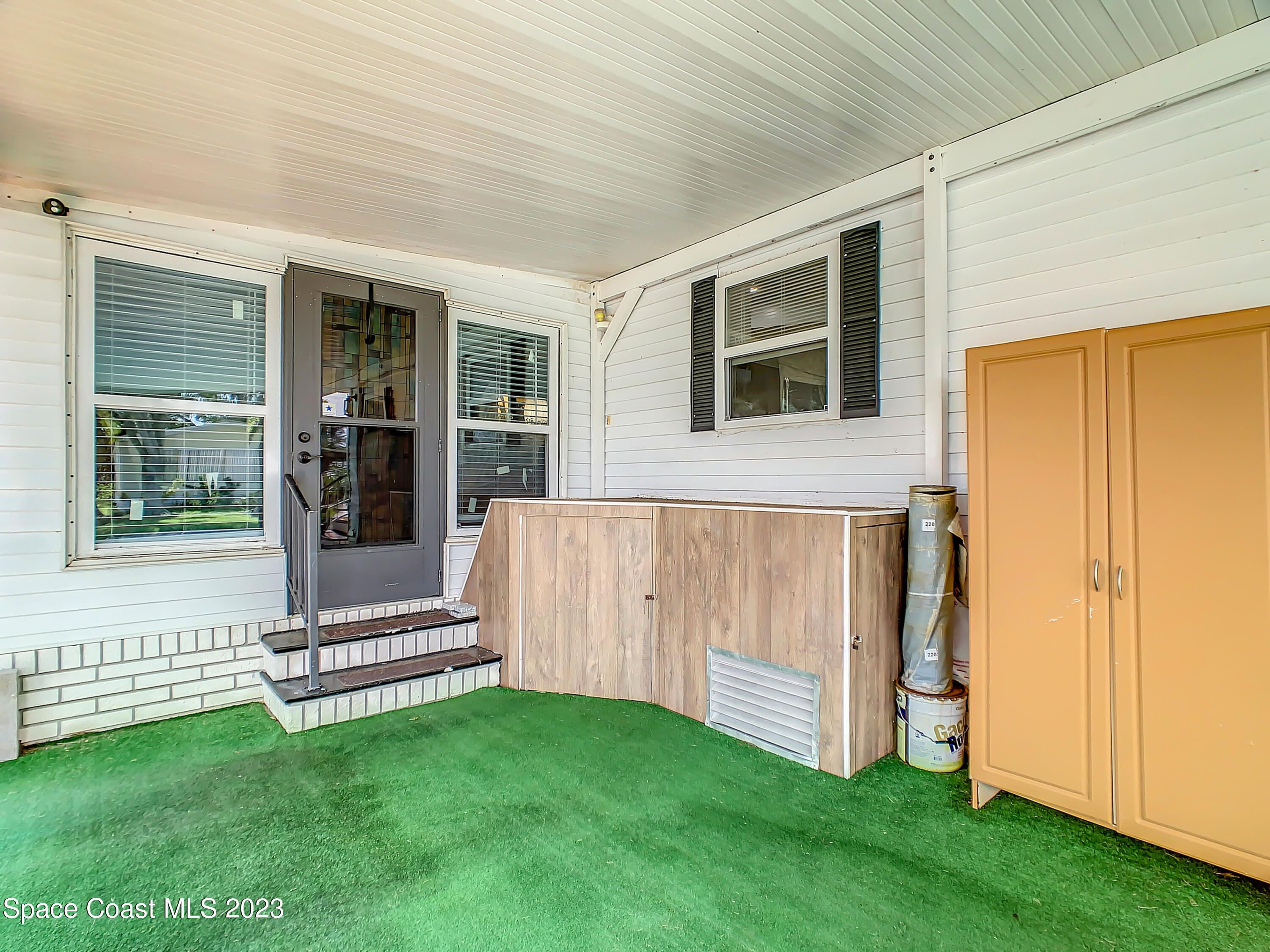 832 Periwinkle Circle Sebastian, FL 32976 - Photo 39 of 52 a view of a house with a backyard