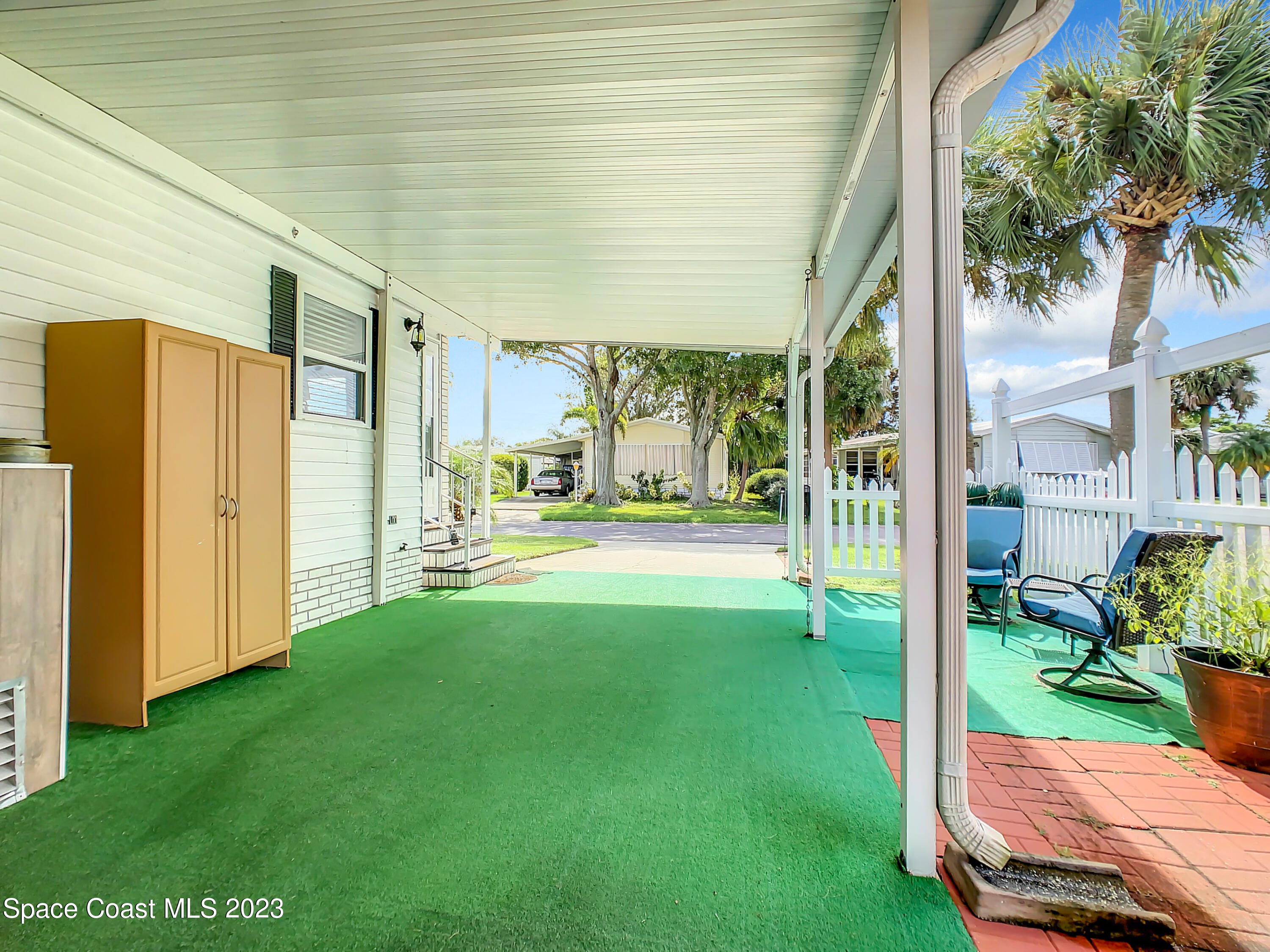 832 Periwinkle Circle Sebastian, FL 32976 - Photo 40 of 52 a view of a porch with furniture