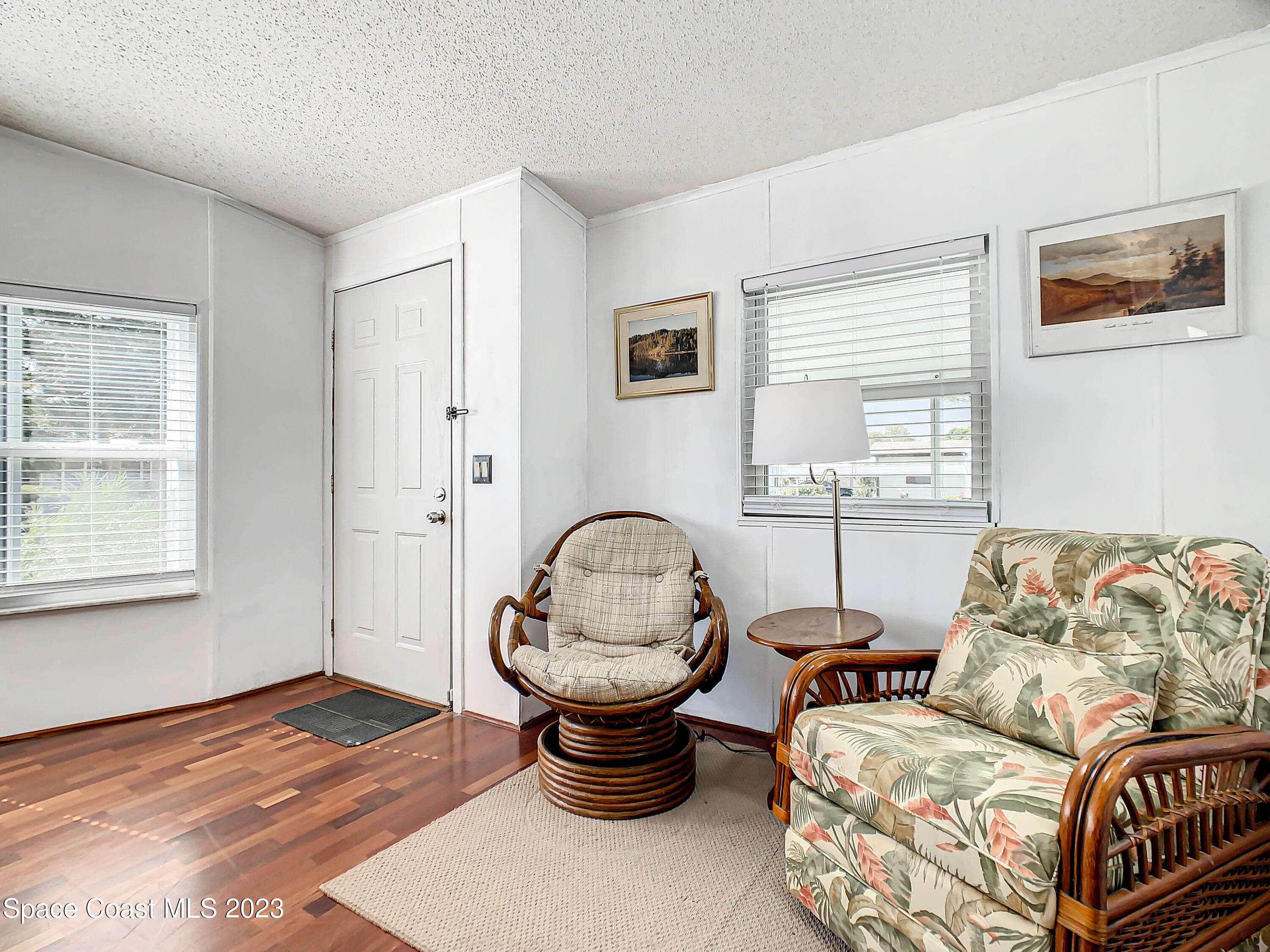 832 Periwinkle Circle Sebastian, FL 32976 - Photo 7 of 52 a living room with furniture a window and a lamp
