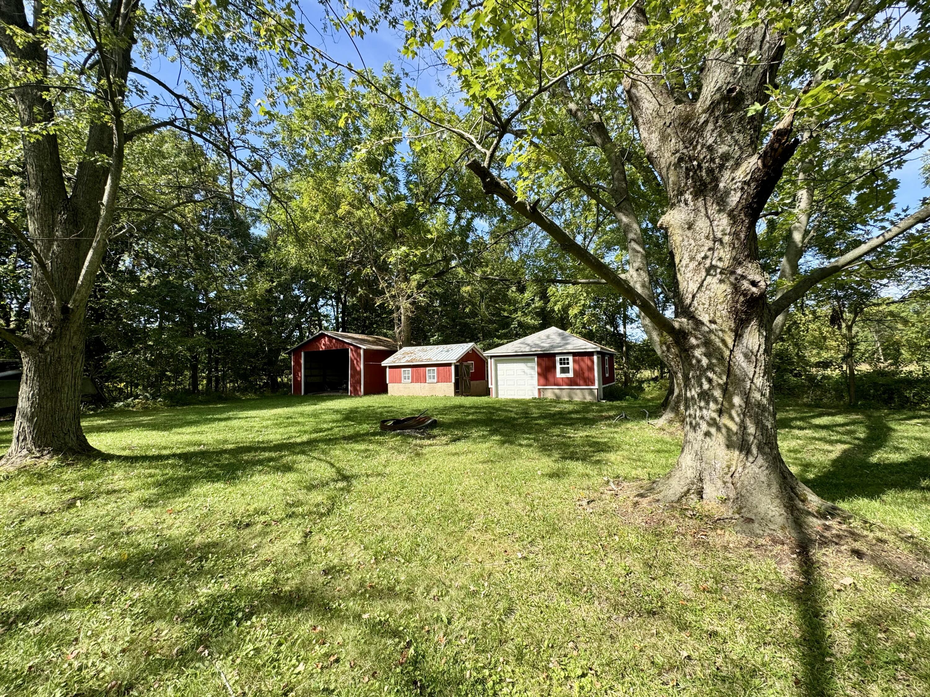 1038 Meridian Road Chesterton, IN 46304 - Photo 6 of 25 a fire hydrant in the middle of a field