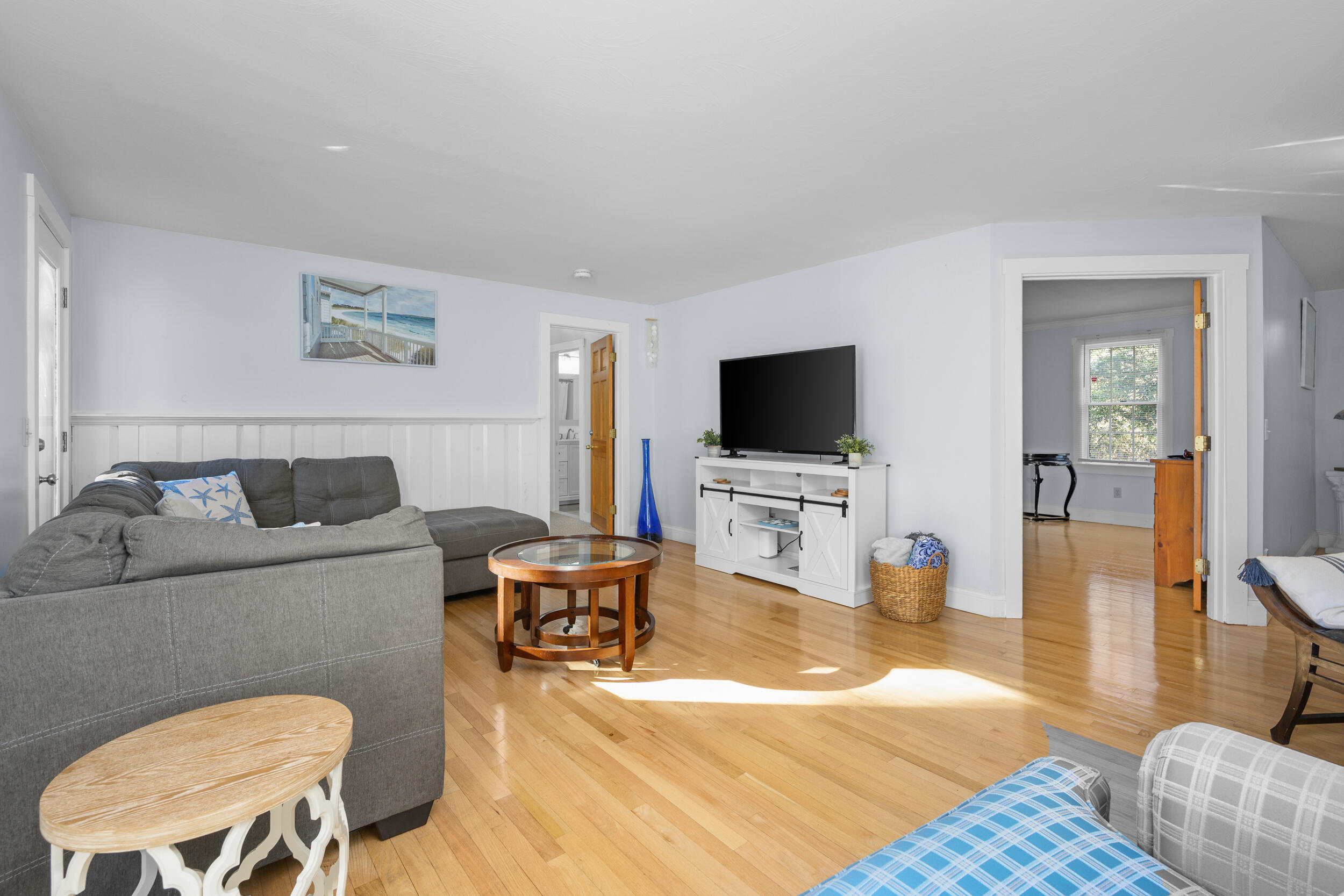 578 Huckins Neck Road Centerville, MA 02632 - Photo 13 of 42 a living room with furniture and a flat screen tv