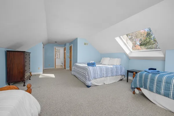 a bedroom with furniture and a window