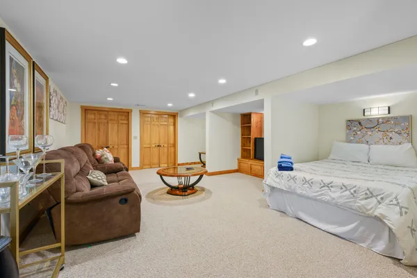a living room with furniture and large windows