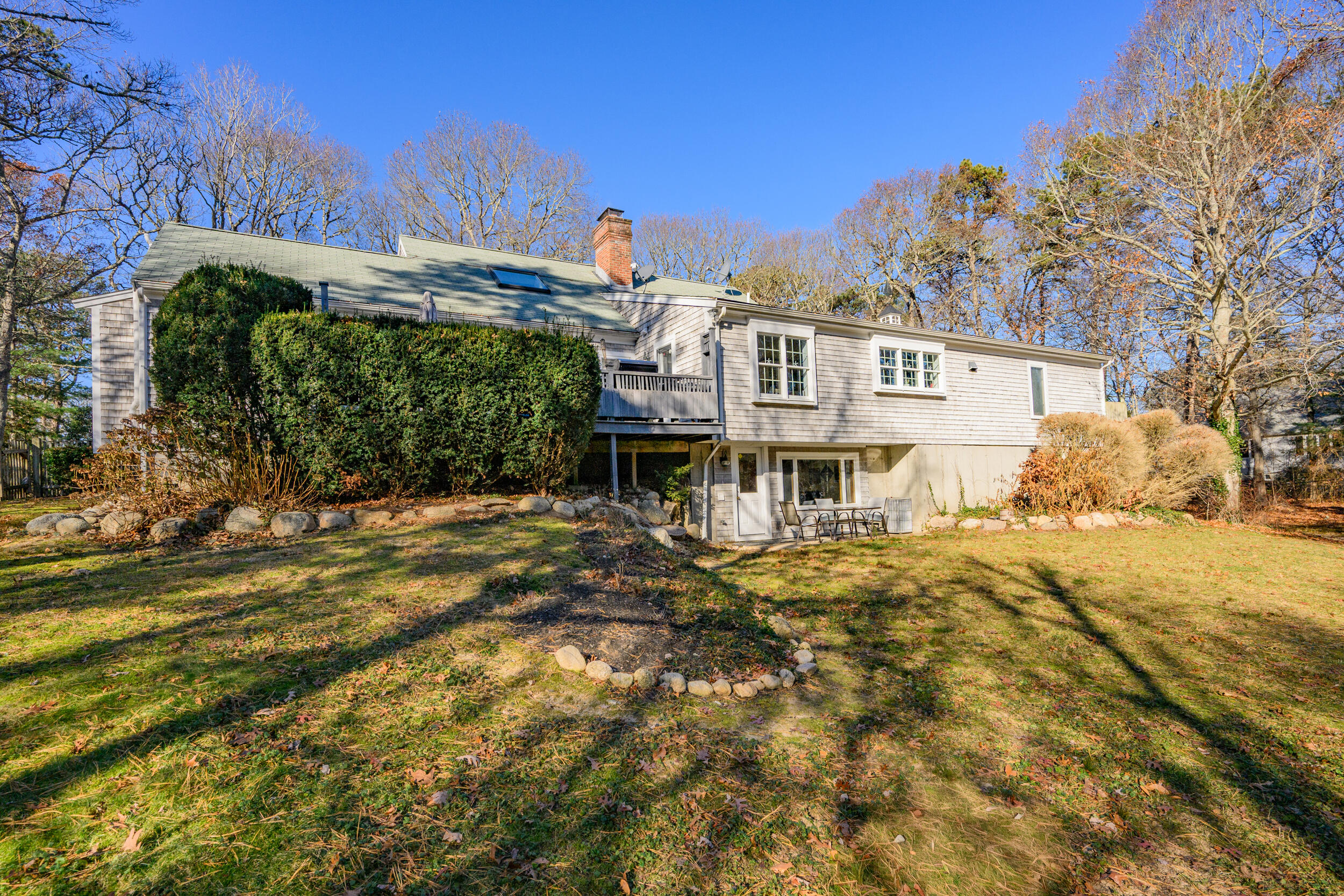 578 Huckins Neck Road Centerville, MA 02632 - Photo 38 of 42 a front view of a house with a yard